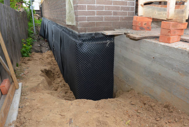 Happy homeowners after waterproofing job in Almond